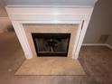 Classic fireplace with a light beige marble surround at 142 Benfield Cir, Cartersville, GA 30121