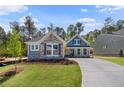 Charming single Gathering home with craftsman elevation, lush lawn, and long driveway at 48 Easton Park Blvd, Dallas, GA 30157