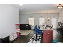 Open concept kitchen and living room with dark hardwood floors and neutral walls at 231 Magnaview Dr, Mcdonough, GA 30253