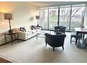 Bright living room with floor to ceiling windows and elegant decor at 2575 Peachtree Ne Rd # 11D, Atlanta, GA 30305