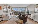 Living room showcasing large windows with a view, and modern decor at 2575 Peachtree Ne Rd # 11D, Atlanta, GA 30305