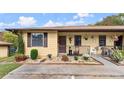 Inviting exterior of a yellow single-story home with landscaping and a small porch at 1101 New Horizon St, Powder Springs, GA 30127