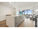 Open plan kitchen with island and living area view at 788 W Marietta Nw St # 1513, Atlanta, GA 30318