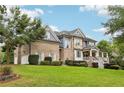 Two-story home with a side view showcasing brick and siding at 3051 Oglethorpe Ne Way, Brookhaven, GA 30319