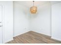 Simple dining area with wood-look floors and a stylish light fixture at 3040 Peachtree Rd # 802, Atlanta, GA 30305