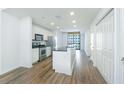 Modern kitchen with stainless steel appliances and an island at 3040 Peachtree Rd # 802, Atlanta, GA 30305