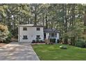 Charming white brick home with a tree-lined yard at 1770 Austin Dr, Decatur, GA 30032