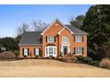 Two-story house with a large front yard at 1685 Terrace Lake Dr, Lawrenceville, GA 30043