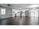 Modern kitchen with stainless steel appliances and dark hardwood floors at 3309 Poplar Dr, Lawrenceville, GA 30044