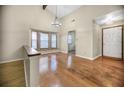 Bright dining room featuring hardwood floors and a chandelier at 778 Villa Way, Jonesboro, GA 30238
