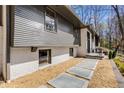 Close up of modern home exterior with concrete pavers, gravel, and architectural details at 110 Maryeanna Ne Dr, Atlanta, GA 30342