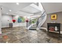 Elegant entrance foyer showcasing a grand staircase and artistic decor at 560 Dutch Valley Ne Rd # 209, Atlanta, GA 30324