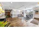 Hallway features hardwood floors, modern lighting, and neutral color palette at 560 Dutch Valley Ne Rd # 209, Atlanta, GA 30324