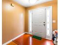 Inviting foyer with hardwood floors, white door and sidelights at 632 Shoal Cir, Lawrenceville, GA 30046