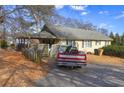 House with a carport and a spacious backyard at 141 Hill St, Roswell, GA 30075