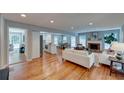 Bright and airy living room with hardwood floors, a cozy fireplace, and an open concept layout at 4540 Club Valley Ne Dr, Atlanta, GA 30319