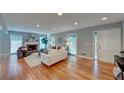 Inviting living room filled with natural light, a charming fireplace, and beautiful hardwood flooring at 4540 Club Valley Ne Dr, Atlanta, GA 30319