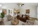 Open floor plan living room with modern furniture and kitchen in the background at 20 Trace Ct, Covington, GA 30016