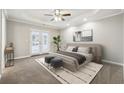 Spacious main bedroom with trey ceilings, french doors to backyard, and neutral tones at 20 Trace Ct, Covington, GA 30016