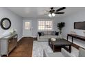 Bright living room with hardwood floors and comfy seating at 7771 Mattie Mccoy Ln, Winston, GA 30187