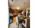 Kitchen with an island, stainless steel appliances, and a dining area at 730 Donner Ct, Mcdonough, GA 30252