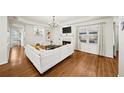 Comfortable living room with a fireplace, hardwood floors, and ample natural light at 85 Sara Dr, Covington, GA 30016
