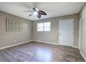 Bedroom with grey walls, wood-look flooring, and ceiling fan at 3460 Meadowview Dr, Lithia Springs, GA 30122