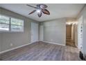 Living room with grey walls, wood-look flooring, and ceiling fan at 3460 Meadowview Dr, Lithia Springs, GA 30122