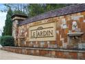 Stone entrance to Le Jardin community with lion head accents at 4271 Matisse Ln, Fairburn, GA 30213