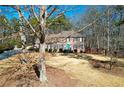 Two-story house with a large yard and mature trees at 125 Lamberth Lake Dr, Fayetteville, GA 30215