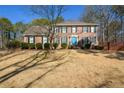 Two-story brick home with a large front yard at 125 Lamberth Lake Dr, Fayetteville, GA 30215