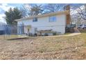 Spacious backyard with trampoline and partial view of home at 830 Forrest St, Roswell, GA 30075