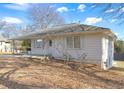 White Ranch style home with covered porch, mature trees and a large yard at 830 Forrest St, Roswell, GA 30075