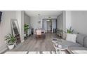 Open concept living and dining area with hardwood floors and modern furniture at 1280 W Peachtree Nw St # 2207, Atlanta, GA 30309