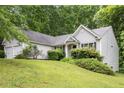 Well-maintained home with manicured landscaping and lush green lawn at 245 London Ln, Hiram, GA 30141