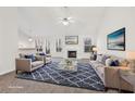 Bright living room with a fireplace, lots of natural light, and stylish furniture at 245 London Ln, Hiram, GA 30141