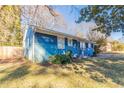 Side view of a blue house with a fenced yard at 3024 Catalina Dr, Decatur, GA 30032