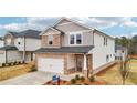 Attractive two-story home with stone accents and a two-car garage at 701 Lily Blossom Path Path, Lawrenceville, GA 30045
