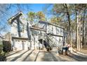 Gray two-story house with a double garage and deck at 1501 Old John Ward Sw Rd, Marietta, GA 30064