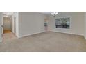 Spacious living room with neutral carpeting and large window at 2686 Caleb James Rd, Marietta, GA 30064
