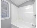 Bathroom with shower and tub, neutral walls at 281 Valley Lake Dr, Stone Mountain, GA 30087