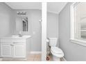Simple bathroom with toilet and sink vanity at 281 Valley Lake Dr, Stone Mountain, GA 30087