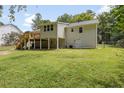 Exterior view showcasing a spacious backyard with a wooden deck, offering ample space for outdoor activities and relaxation at 641 Virginia Ave, Suwanee, GA 30024