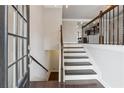 Inviting foyer features hardwood floors and a staircase leading to the upper level and basement at 4196 Morrison Way # 11, Atlanta, GA 30341
