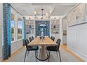 Elegant dining room featuring a built-in buffet and modern light fixture at 189 Haverling Pass, Hampton, GA 30228