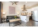 Living room features hardwood floors and an open concept design at 2626 Peachtree Nw Rd # 706, Atlanta, GA 30305