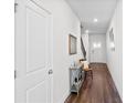 Bright entryway with hardwood floors, decor, and staircase leading to the upper level at 79 Dew Drop Ln, Dallas, GA 30157