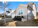 Gray siding, brick base, and landscaping in front of the house at 79 Dew Drop Ln, Dallas, GA 30157