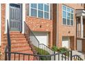 Brick steps and walkway leading to the front entrance of a townhome at 1608 Mosaic Way, Smyrna, GA 30080