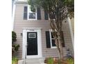 Charming townhome featuring a black front door, two stories, and a well-maintained exterior at 1799 Timber Valley Se Way, Smyrna, GA 30080
